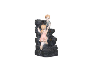 Playful Children Climbing Fountain